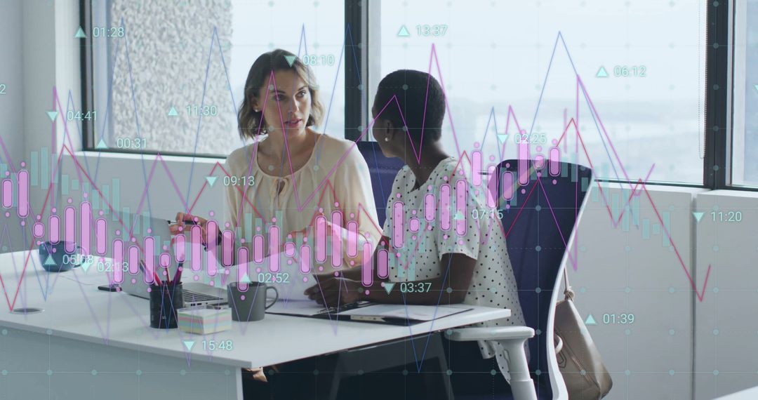 Business Colleagues Analyzing Financial Data With Graph Overlay