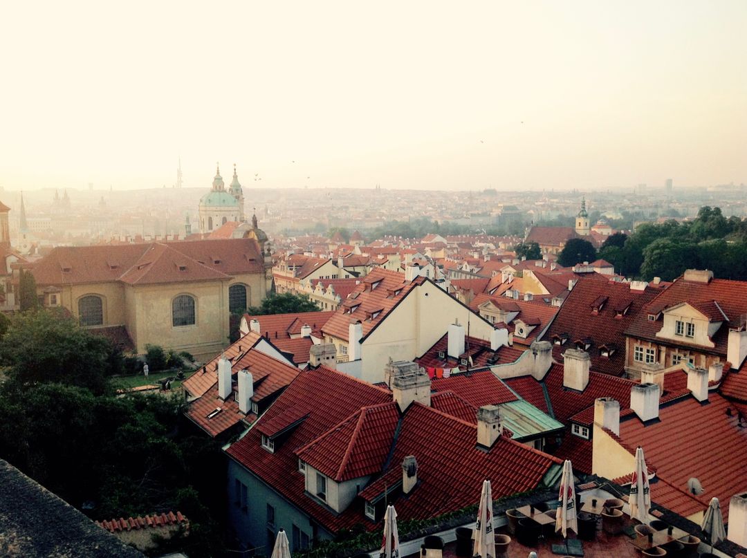 Aerial View of Prague's Historic Red Rooftops at Sunset - Free Images, Stock Photos and Pictures on Pikwizard.com