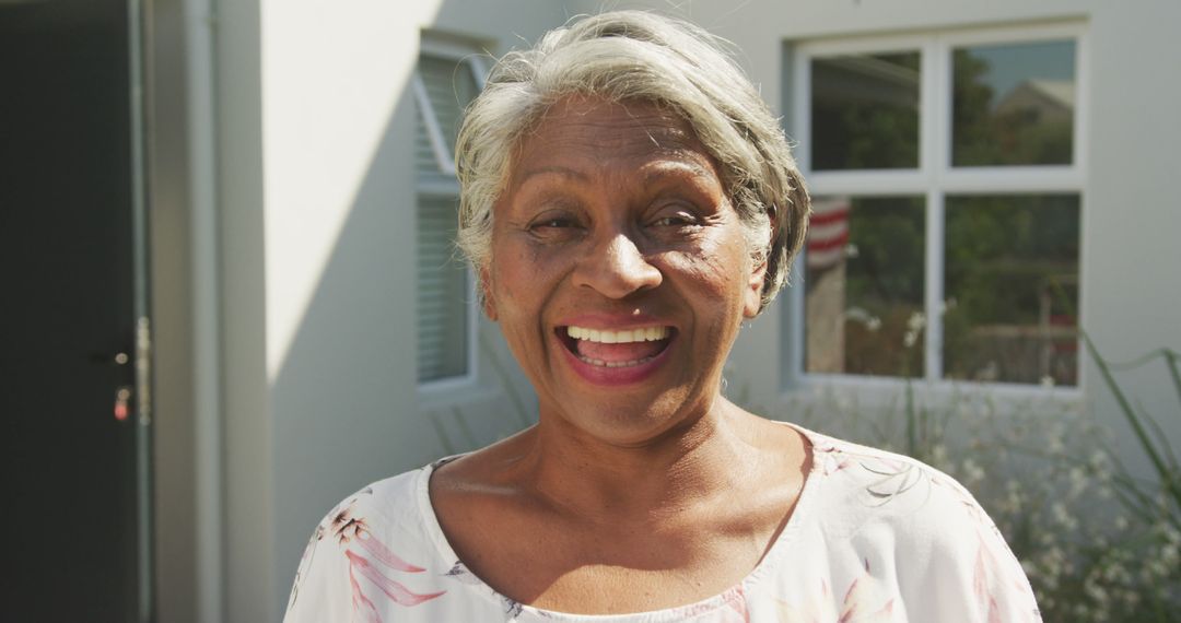 Image of african american senior woman standing outside house - Free Images, Stock Photos and Pictures on Pikwizard.com