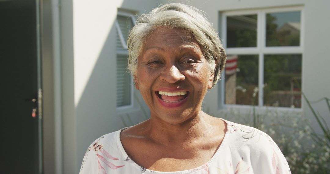 Cheerful Senior Woman Smiling Happily Outdoors - Free Images, Stock Photos and Pictures on Pikwizard.com