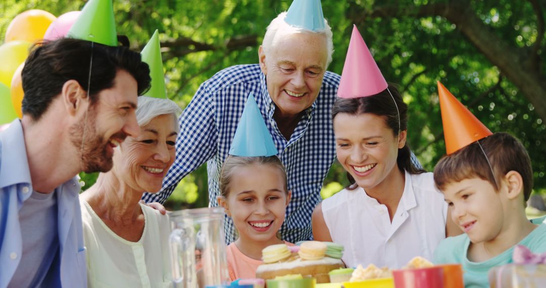 Multigenerational Family Enjoying Outdoor Birthday Celebration - Free Images, Stock Photos and Pictures on Pikwizard.com