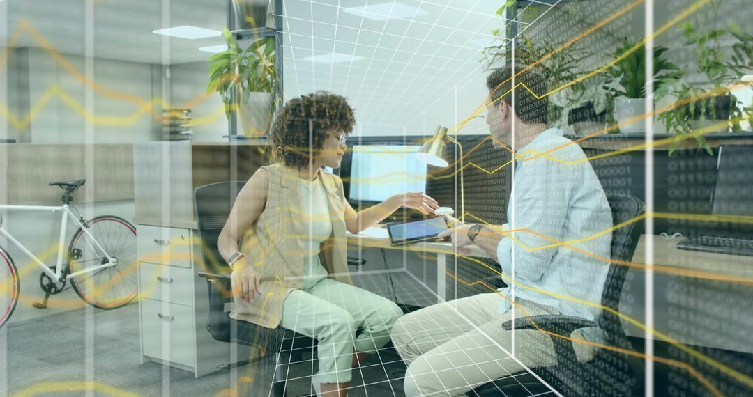 Teamwork in Modern Office with Data Graphics Overlay