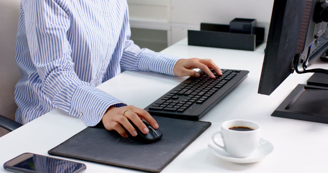 Professional Typing on Keyboard at Modern Workspace Desk