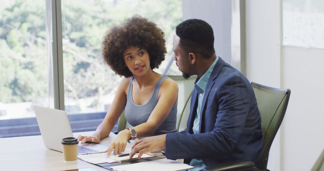 Focused Teamwork Between Businessman and Designer in Modern Office