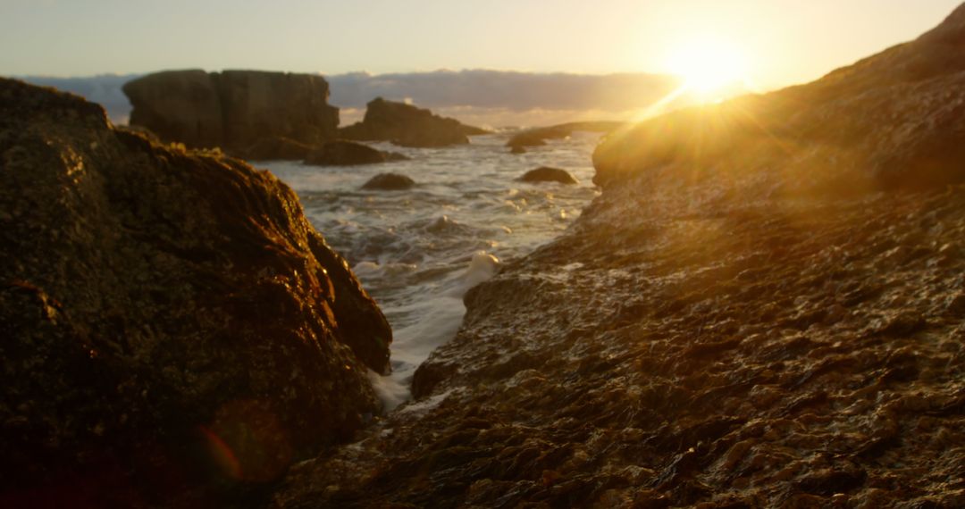 Sunset Over Rocky Coast with Ocean Waves - Free Images, Stock Photos and Pictures on Pikwizard.com