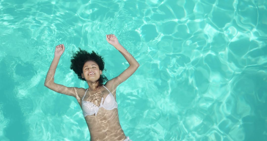 Smiling Women Floating Relaxedly in Swimming Pool - Free Images, Stock Photos and Pictures on Pikwizard.com