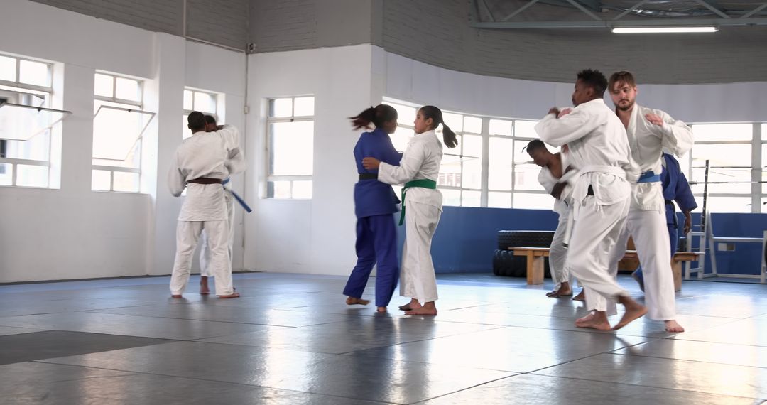 Martial Arts Trainees Engaged in Intense Grappling Drills