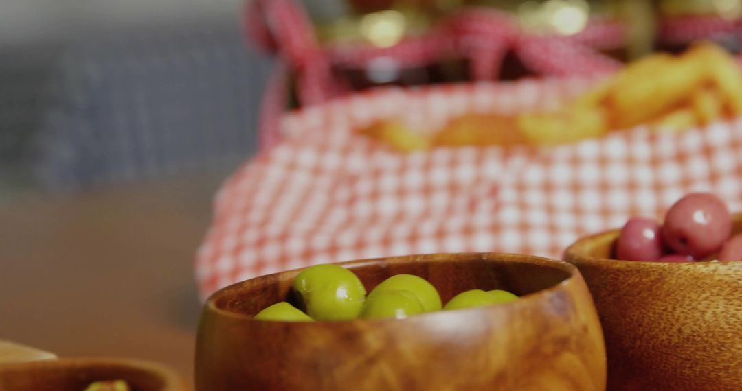 Wooden Bowls of Olives with Rustic Picnic Setup