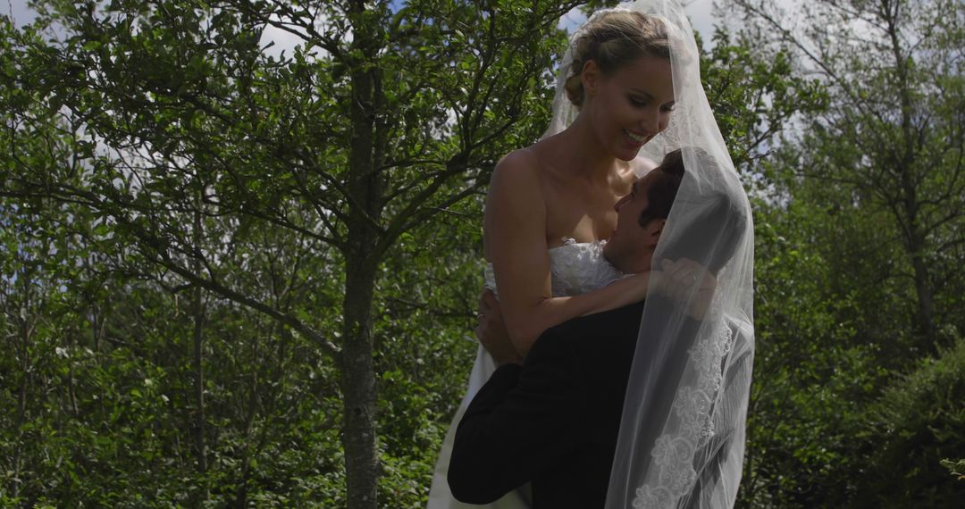 Happy Bride and Groom Embrace Outdoors on Wedding Day - Free Images, Stock Photos and Pictures on Pikwizard.com