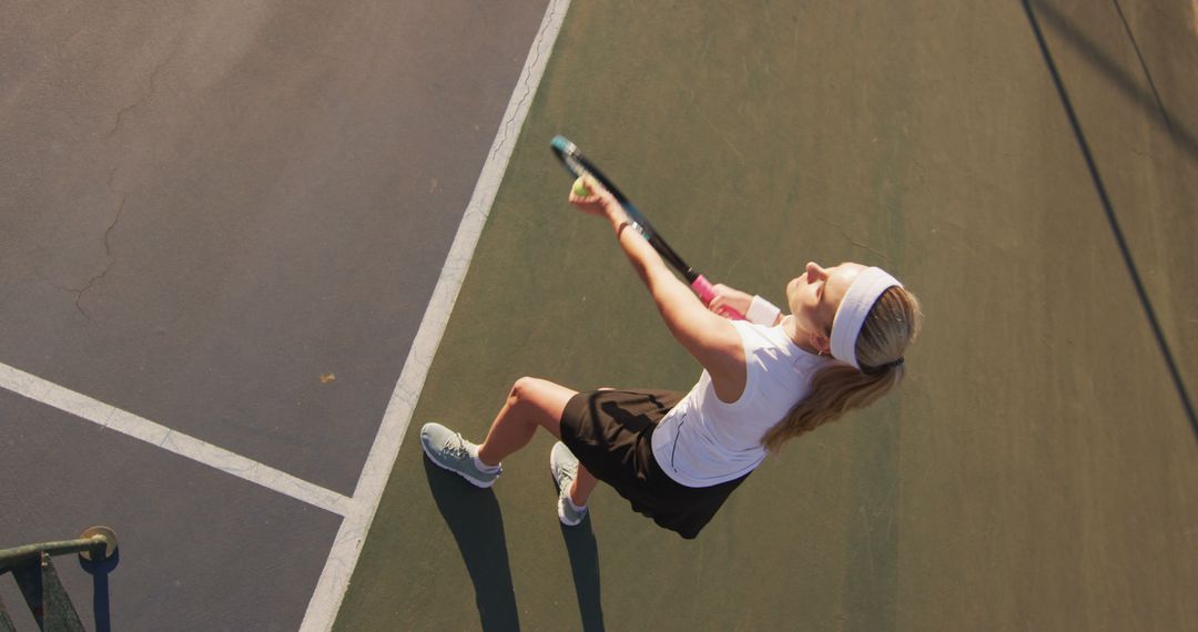 Female Tennis Player Serving On Court - Free Images, Stock Photos and Pictures on Pikwizard.com