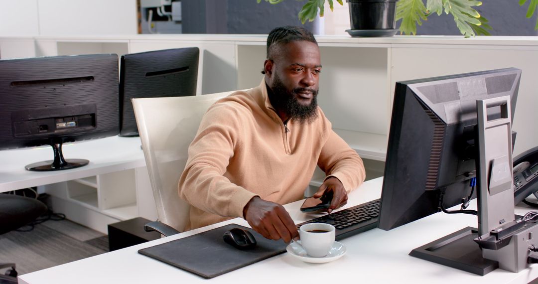 African American Man Working with Coffee in Modern Office