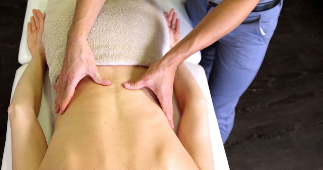 Physiotherapist Performing Therapeutic Back Massage - Free Images, Stock Photos and Pictures on Pikwizard.com