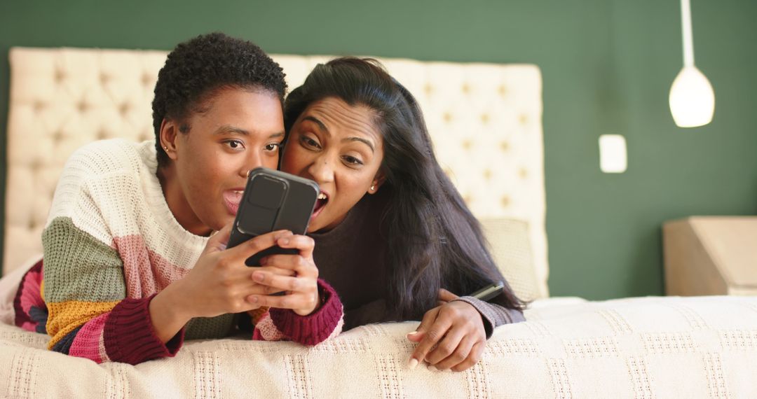 Diverse Friends Relaxing at Home Enjoying Smartphone