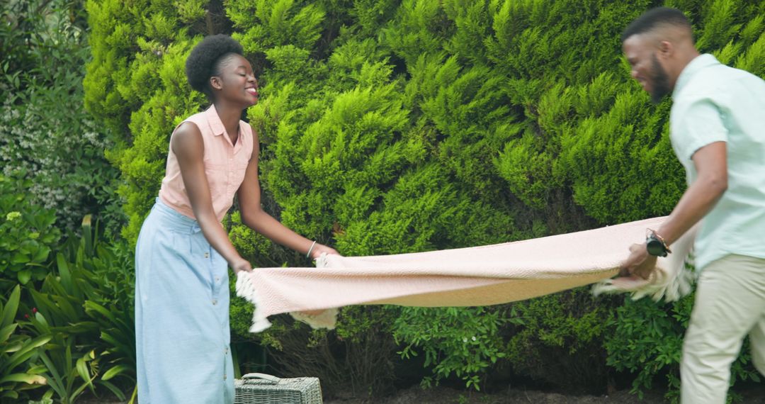 Joyful Couple Enjoying Outdoor Leisure Amidst Lush Greenery