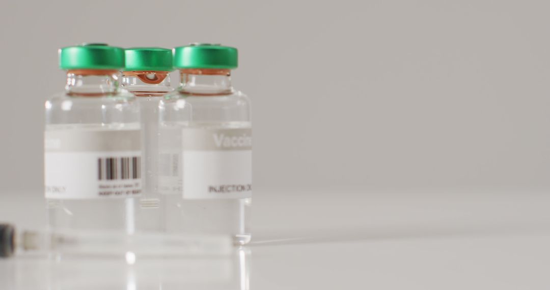 Image of close up of vaccine vials on white background - Free Images, Stock Photos and Pictures on Pikwizard.com