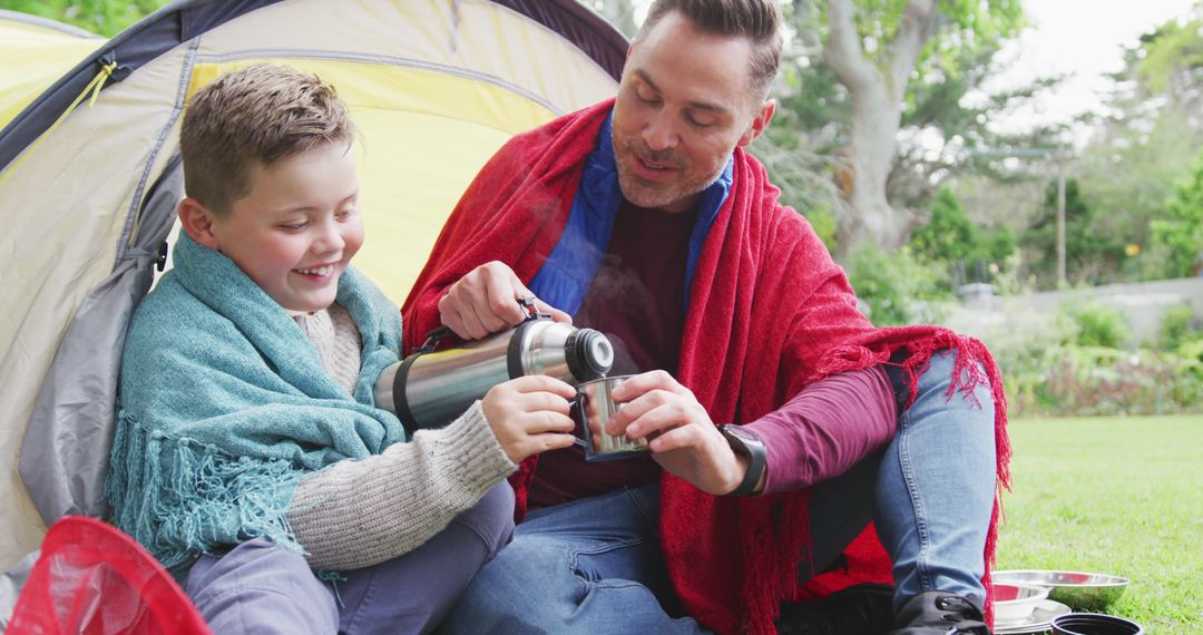 Father and Son Enjoying Tea While Camping in Backyard - Free Images, Stock Photos and Pictures on Pikwizard.com