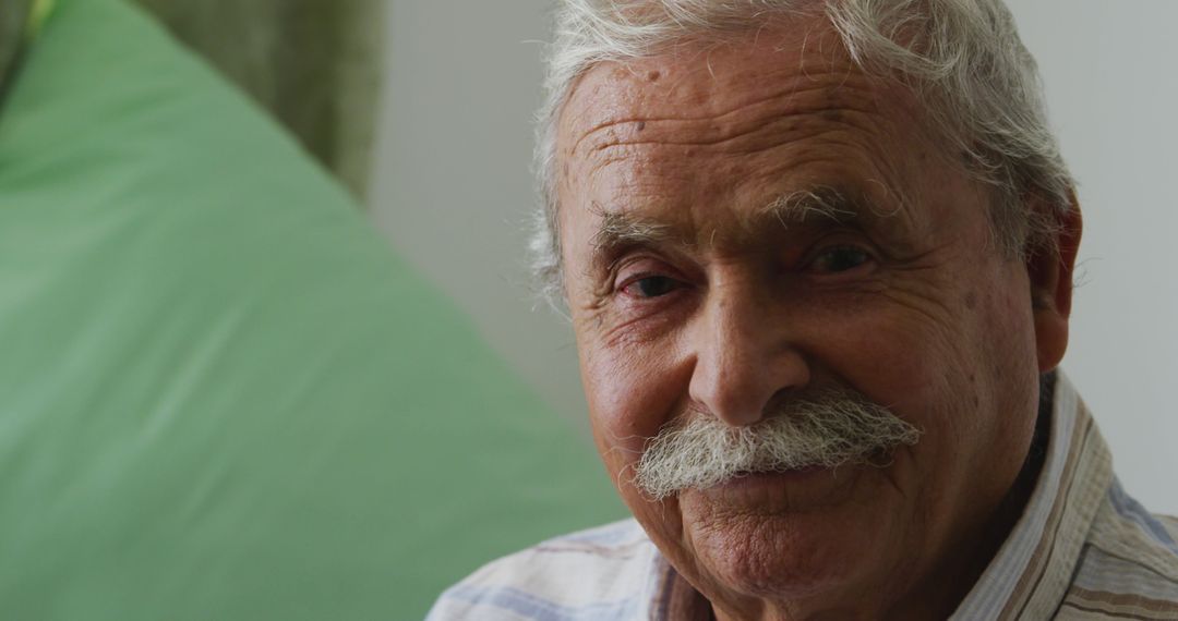 Senior Man Smiling at Retirement Home During Pandemic