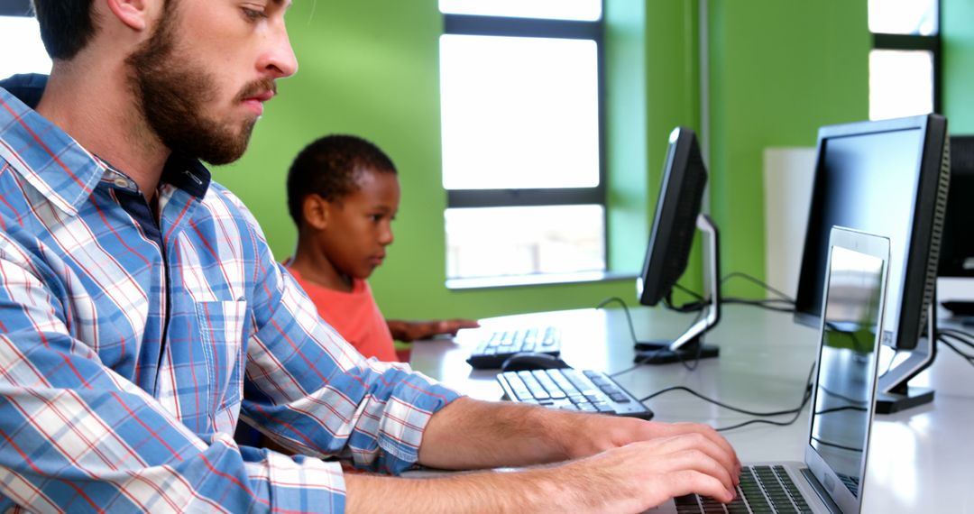 Teacher and Student Using Computers in Classroom - Free Images, Stock Photos and Pictures on Pikwizard.com