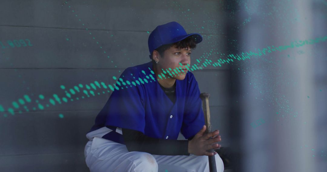 Teen Baseball Player Contemplating Game Strategies on Dugout Bench