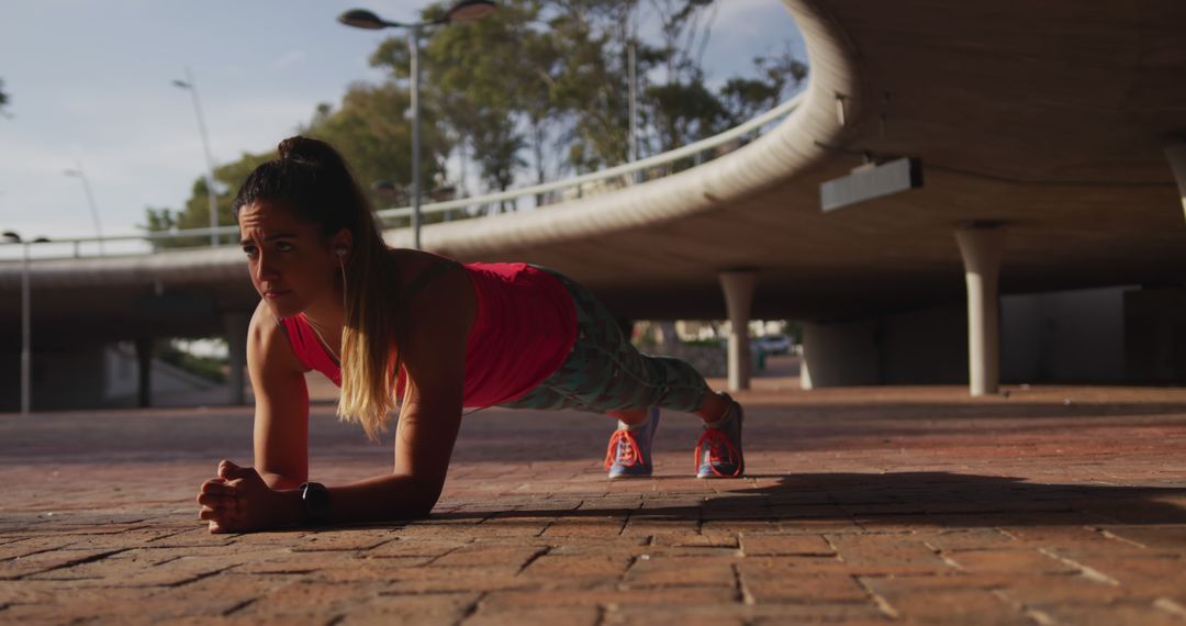 Woman Performing Plank Exercise Outdoors - Free Images, Stock Photos and Pictures on Pikwizard.com