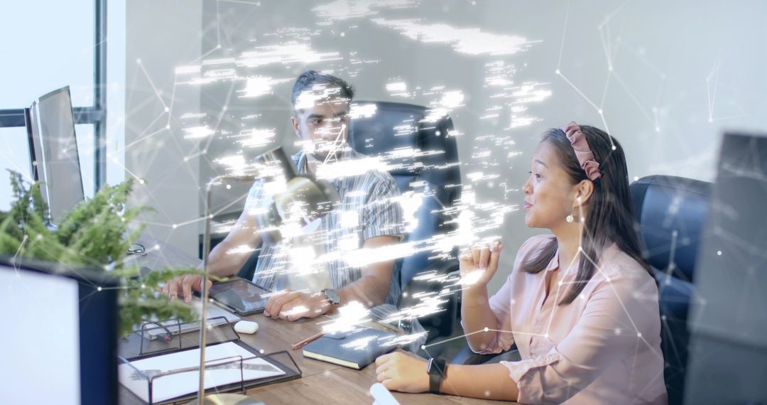 Colleagues Collaborating with Futuristic Digital Interface in Office