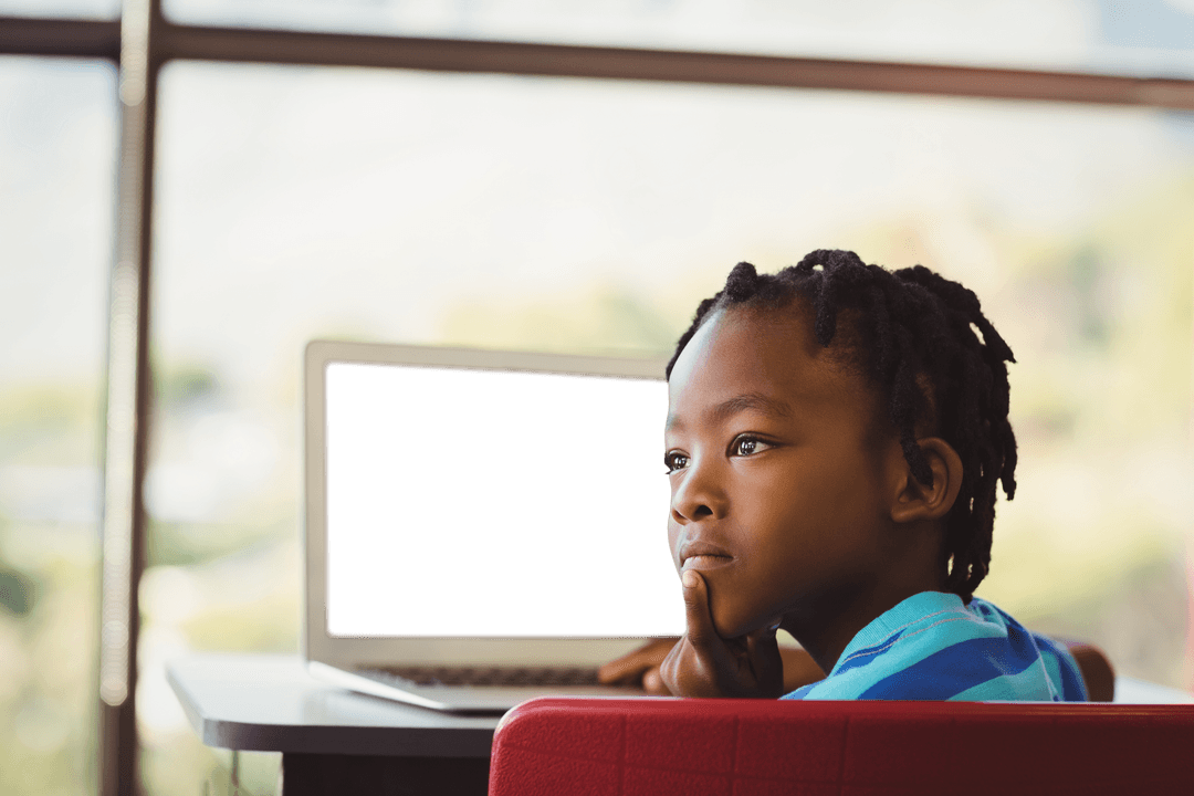 Transparent Cutout: Thoughtful Boy by Laptop in Classroom