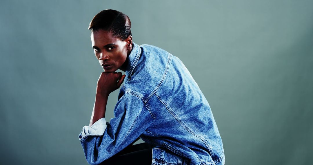 An African American woman poses confidently in a denim jacket, with copy space - Free Images, Stock Photos and Pictures on Pikwizard.com