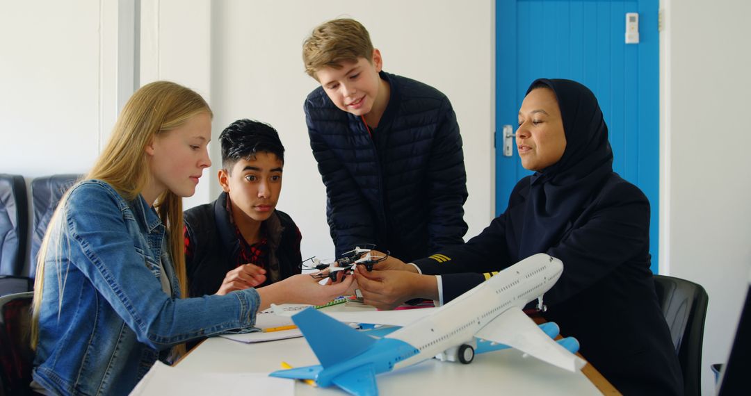 Young Students Learning About Aviation with Female Instructor - Free Images, Stock Photos and Pictures on Pikwizard.com