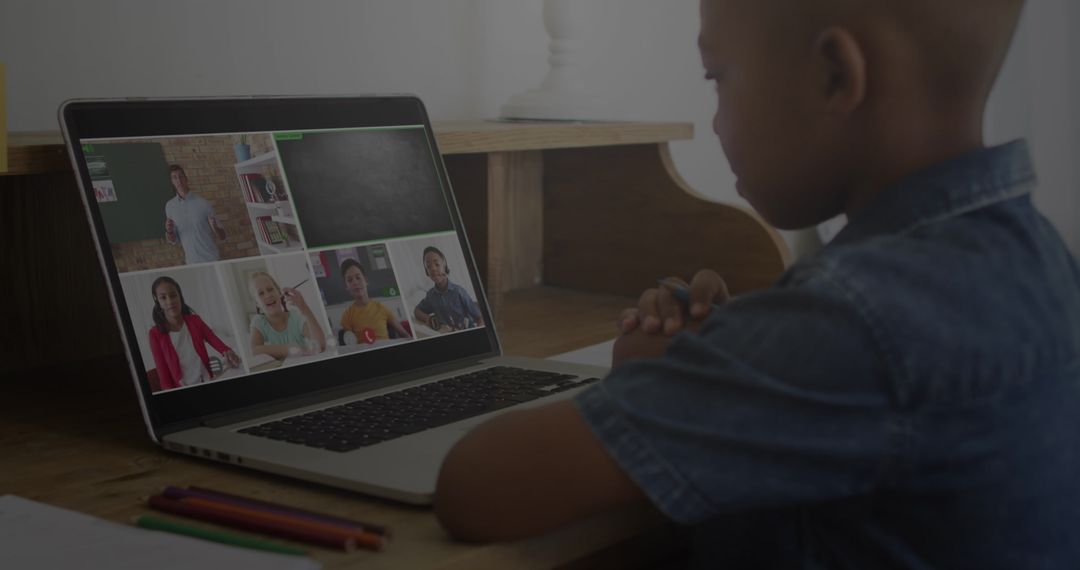 Young Student Engaging in Virtual Learning with Laptop at Home