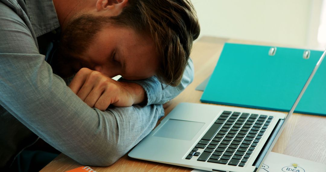 Exhausted Male Employee Falling Asleep at Desk with Laptop - Free Images, Stock Photos and Pictures on Pikwizard.com