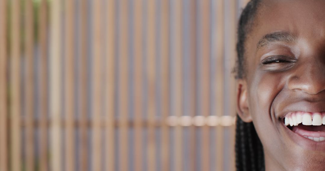 Close-Up of Smiling Black Woman with Braided Hair Outdoors - Free Images, Stock Photos and Pictures on Pikwizard.com