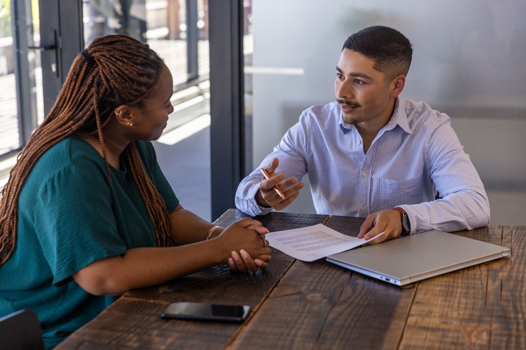 Diverse Team Collaborating in Modern Meeting Space