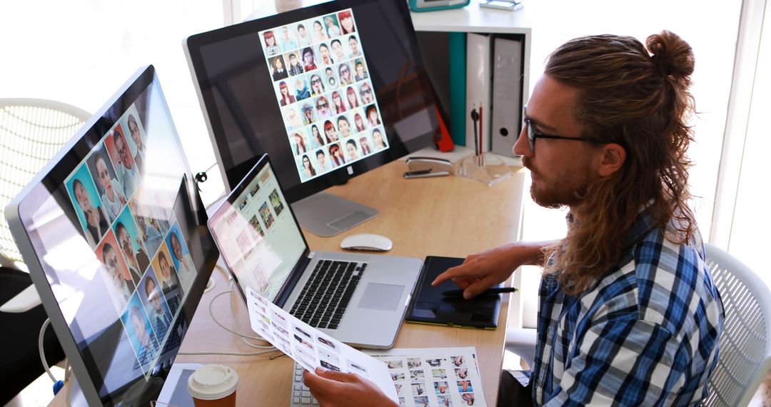 Young Graphic Designer Working on Computer with Multiple Monitors - Free Images, Stock Photos and Pictures on Pikwizard.com