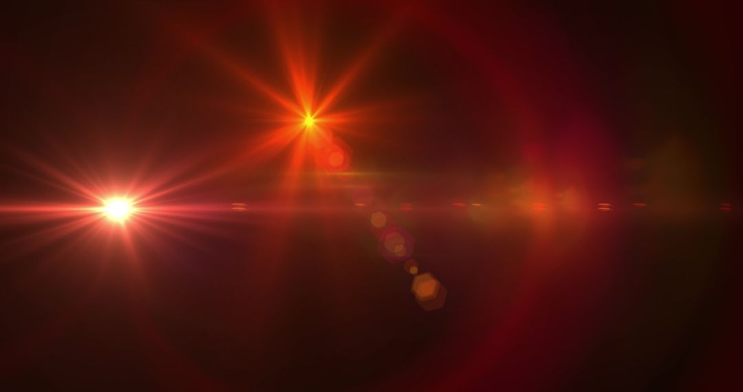 Abstract Red Lens Flare with Glowing Light on Dark Background