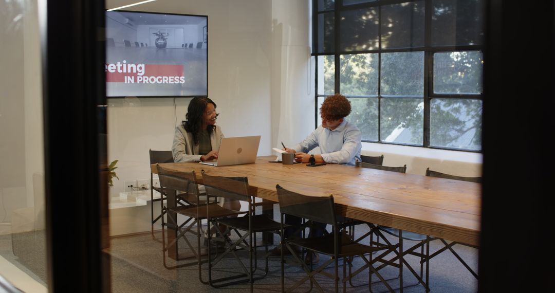 Diverse Professionals Collaborating in Office Meeting Room