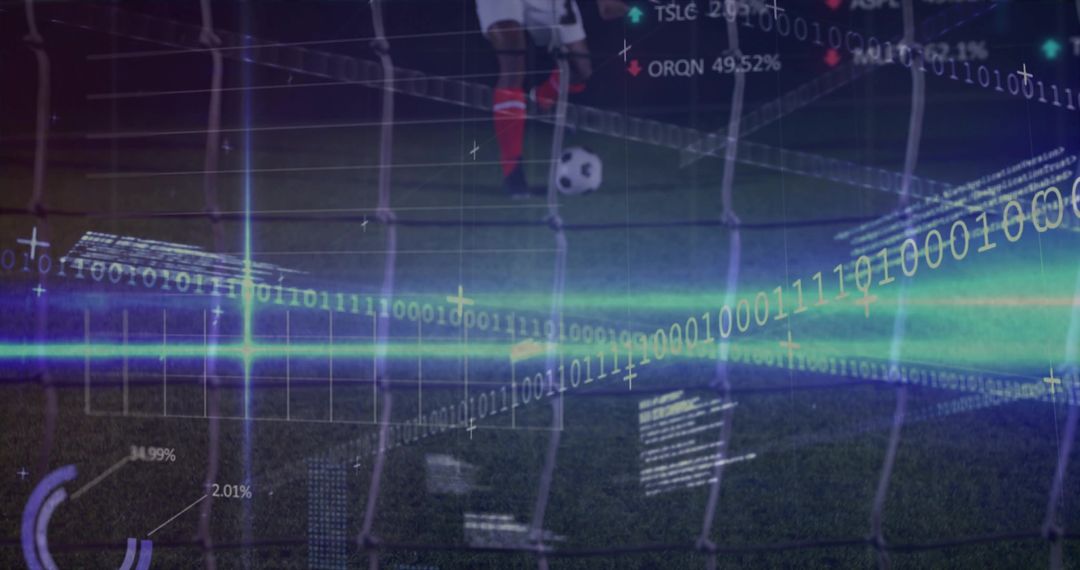 Standing soccer player placing foot on ball on night pitch with net, digital analytics overlay