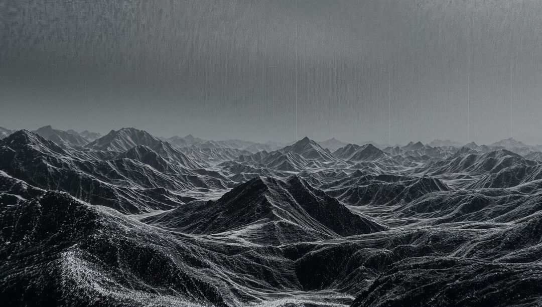 Monochrome Wilderness: Dramatic Jagged Mountain Landscape with Drizzle