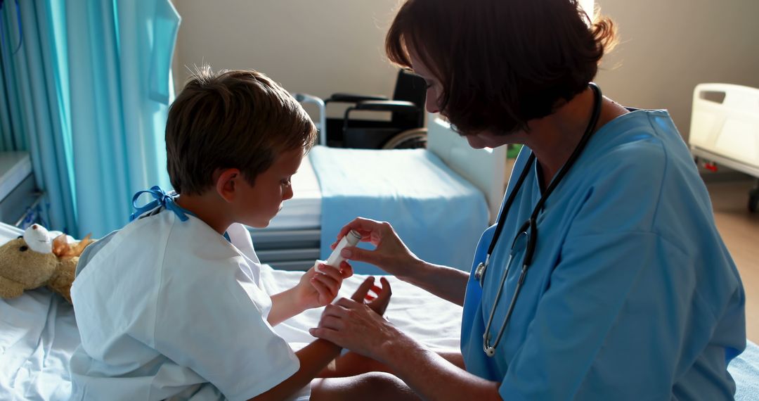 Nurse Treating Child's Arm in Hospital Room - Free Images, Stock Photos and Pictures on Pikwizard.com