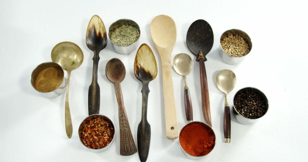 Wooden and Metal Spoons with Spices and Herbs - Free Images, Stock Photos and Pictures on Pikwizard.com