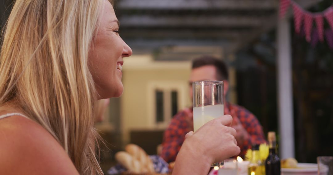 Cheerful Gathering in Garden with Family at Dinner Table