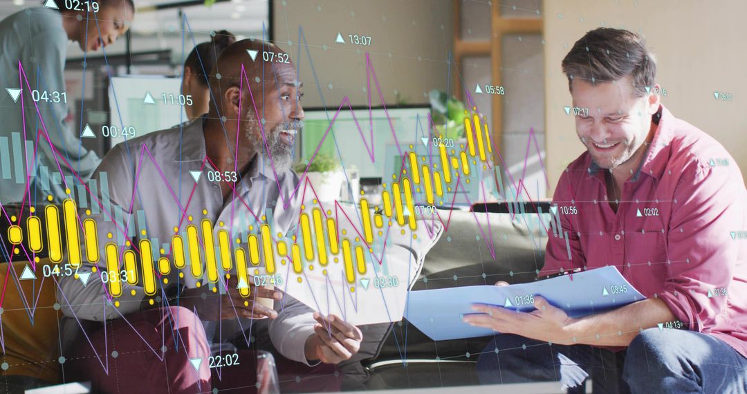 Diverse team collaborating and reviewing analytics overlays on laptop and documents