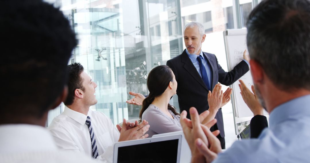 Business Team Applauding Senior Leader In Office Meeting - Free Images, Stock Photos and Pictures on Pikwizard.com