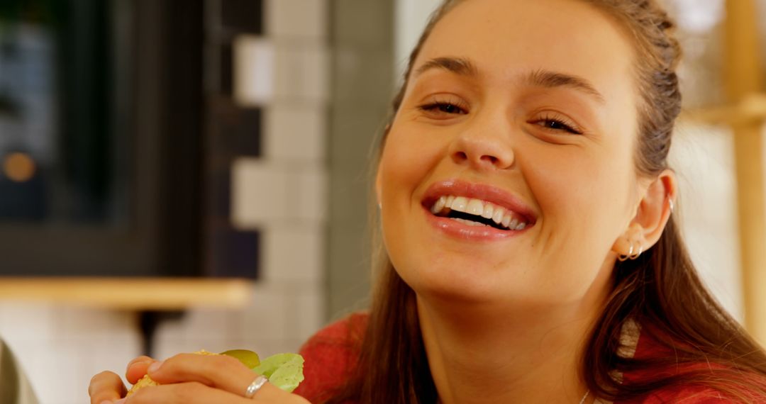 Smiling Woman Enjoying Meal at Cozy Cafe - Free Images, Stock Photos and Pictures on Pikwizard.com