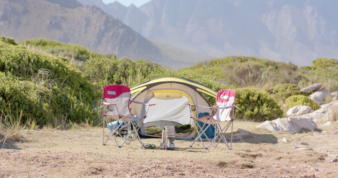 Peaceful Camping Site with Chairs and Tent in Scenic Mountain Landscape - Free Images, Stock Photos and Pictures on Pikwizard.com