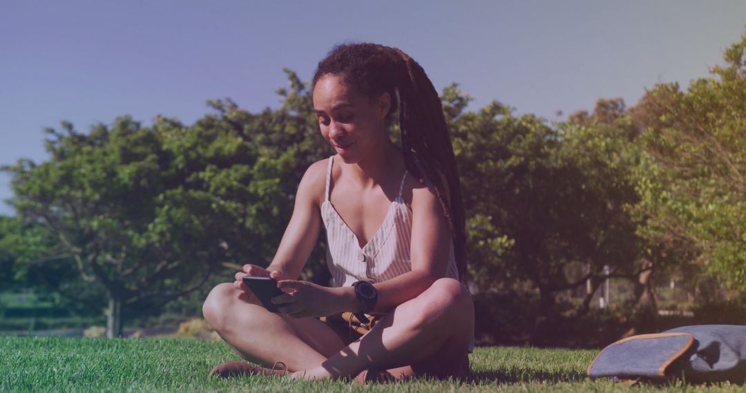 Tech-Savvy Woman Enjoying Outdoor Smartphone Browsing