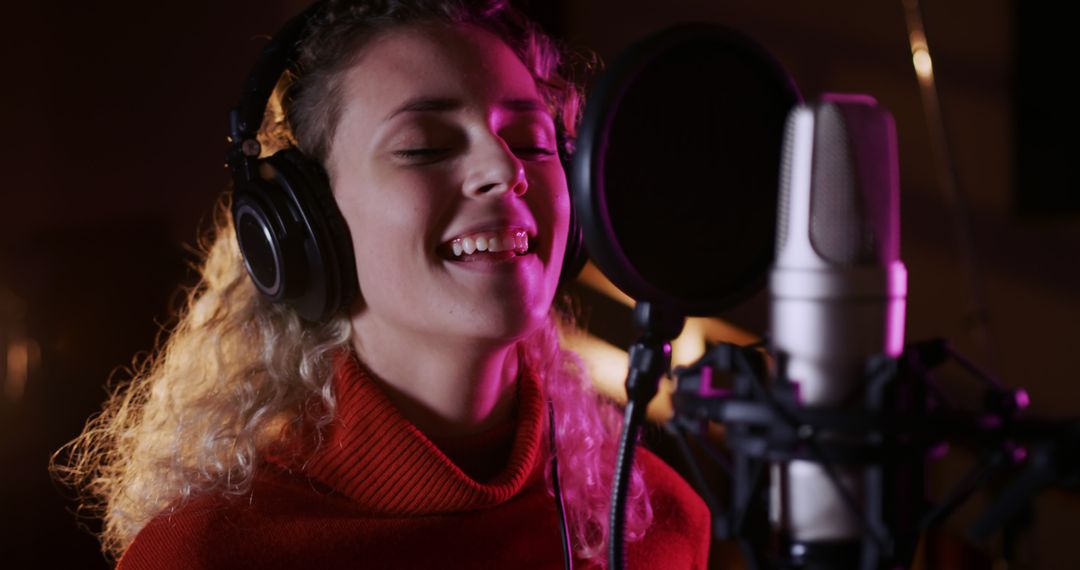 Female Singer Recording Music in Studio with Passion
