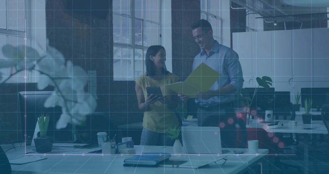 Colleagues Reviewing Data in Modern Office Environment