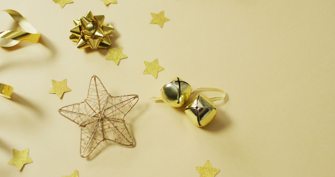 Image of gold christmas decorations with stars on yellow background - Free Images, Stock Photos and Pictures on Pikwizard.com