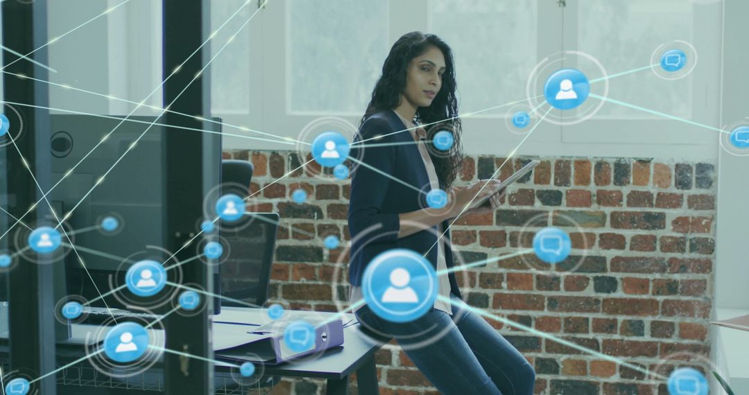 Businesswoman Utilizing Digital Network Interface in Modern Office