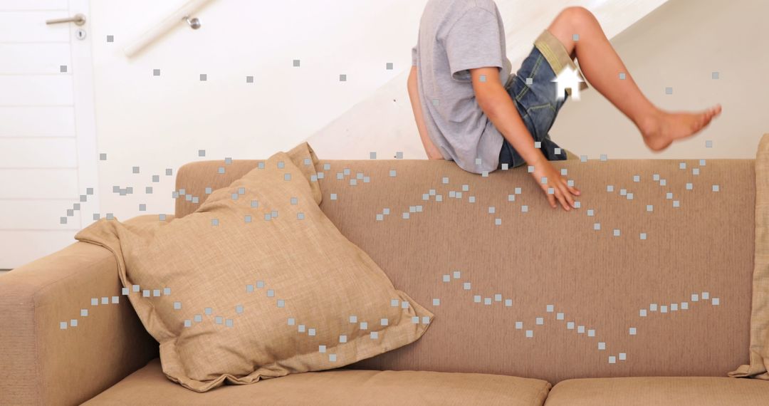 Child Playfully Jumping on Sofa in Cozy Living Space